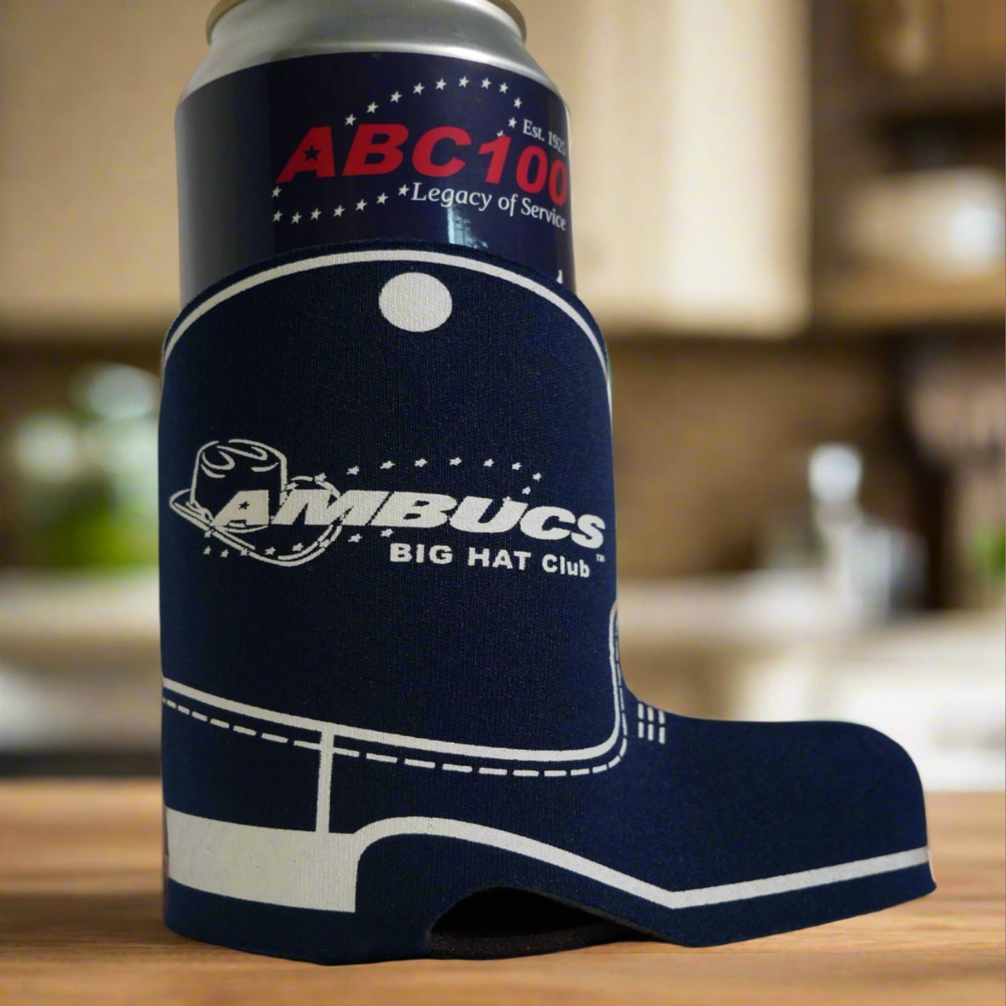 Blue can cooler shaped like a boot trimmed in white. Big Hat Club logo is in the center