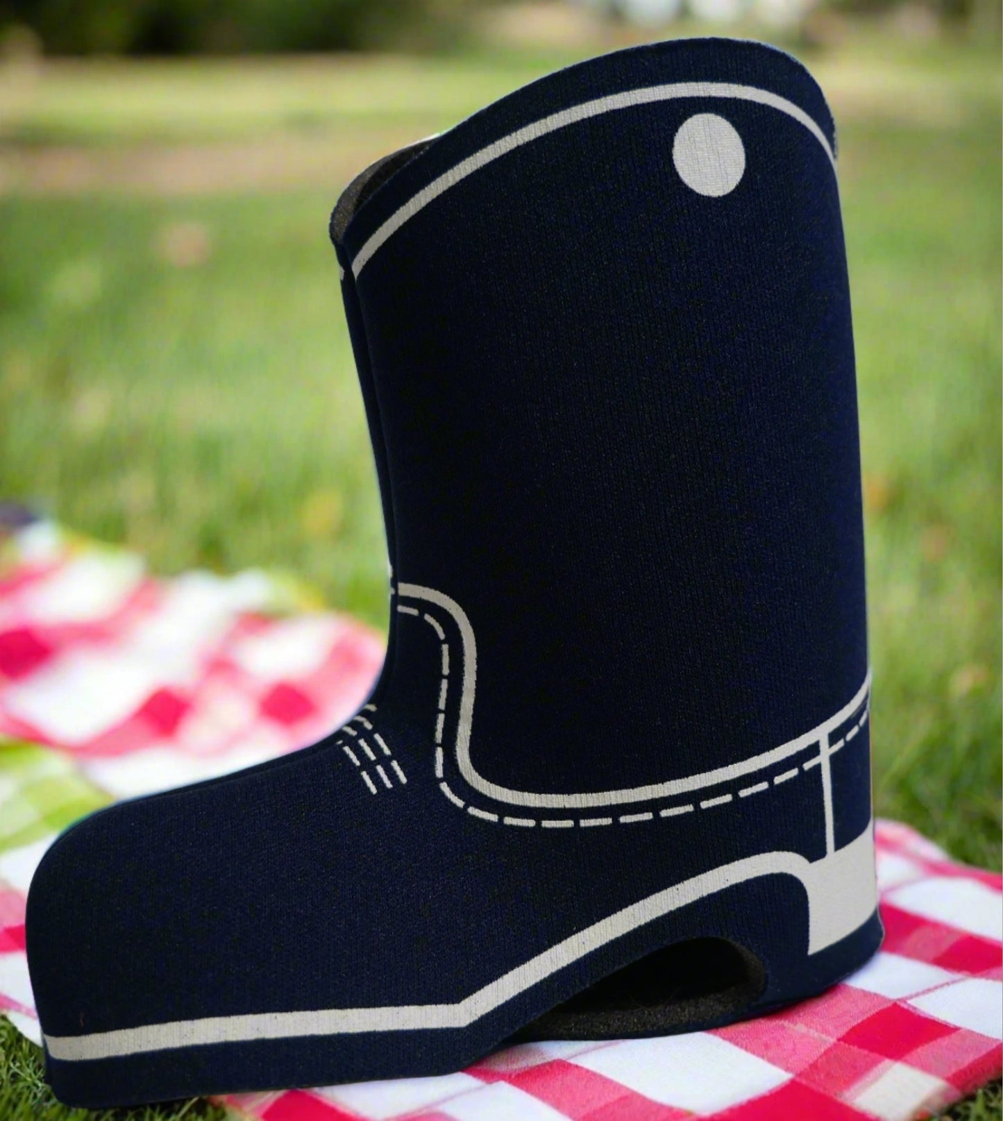 backside of blue boot shaped can cooler. Printed with the white stitching of a boot