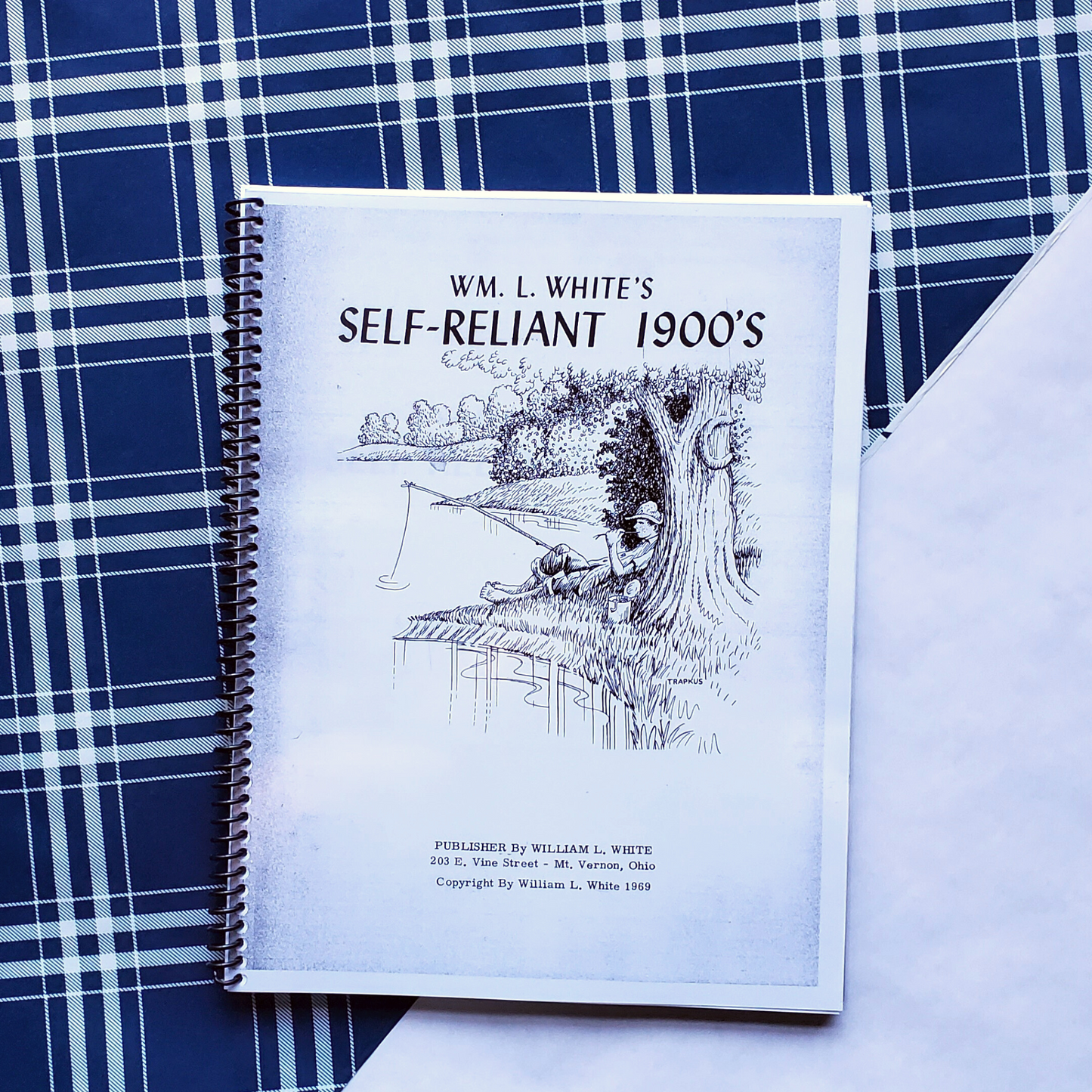 Black and white book cover of William L. White's Self-Reliant 1900's. Cover is a drawing of a young man sitting under a tree by a river with a fishing pole in hand