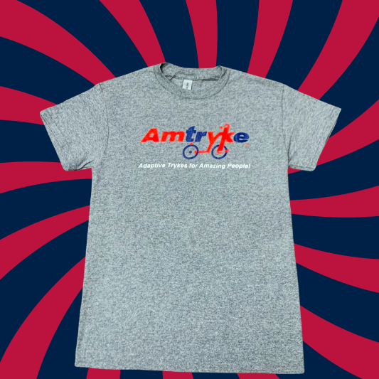 Grey t-shirt with Amtryke written in red and blue lettering at the top and the words "Adaptive Trykes for Amazing People" written below.   The letters Y and K connect  two wheels to form a side view of a tryke. 