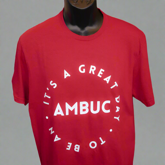 red t-shirt with the words "it's a great day to be an" written in a circle.  The word AMBUC is written in the middle of the circle with the other words surrounding.  