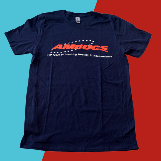 Dark blue t-shirt with red AMBUCS logo in middle.  One hundred years of inspiring mobility and independence written underneath in white lettering